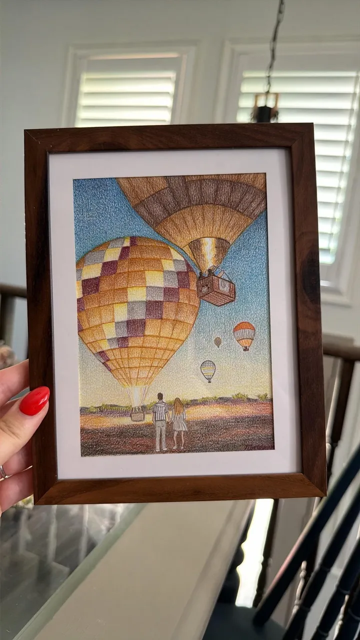 Framed pencil crayon drawing of hot air balloons